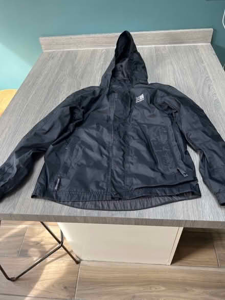 Photo of free Karrimor Black waterproof coat. 9-10 years. Good condition. (Southsea PO4) #1