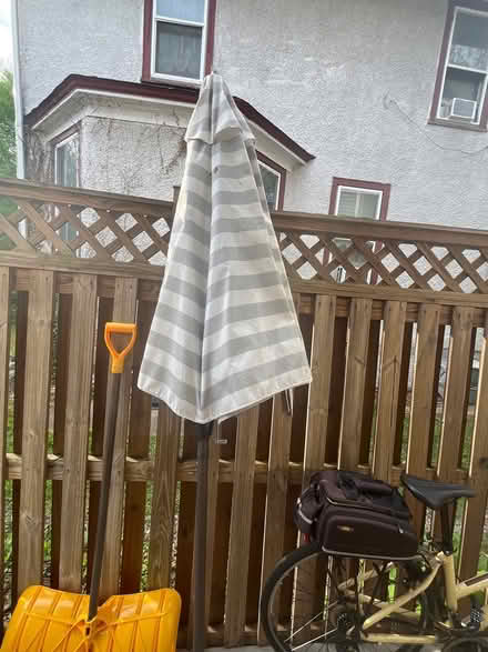 Photo of free Gray/white stripe outdoor umbrella (16th St Heights/Petworth) #1