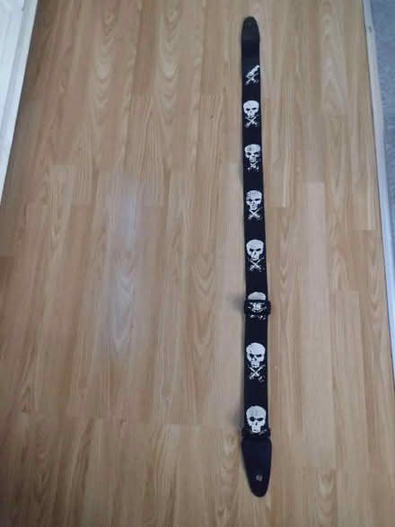 Photo of free Guitar strap with skull and cross bones (Ashton-U-Lyne OL6) #1