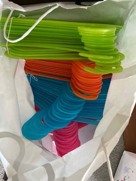 Photo of free 60 ish coloured plastic kids IKEA coat hangers (Holcot) #1