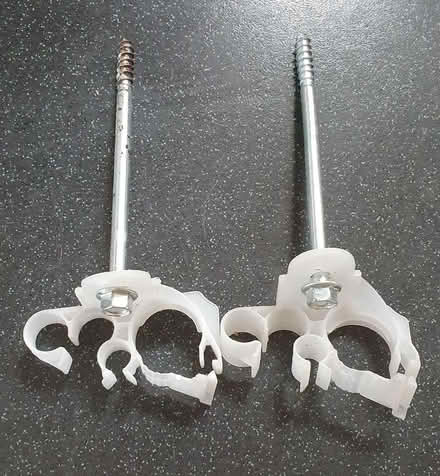 Photo of free 2 x Long screws with pipe holders (Springfield CM1) #1