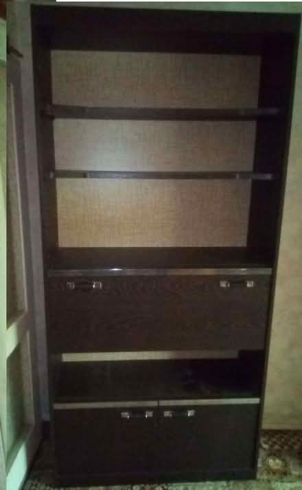 Photo of free Black Wood grained shelving unit with drop-down door (Hoddesdon EN11) #1