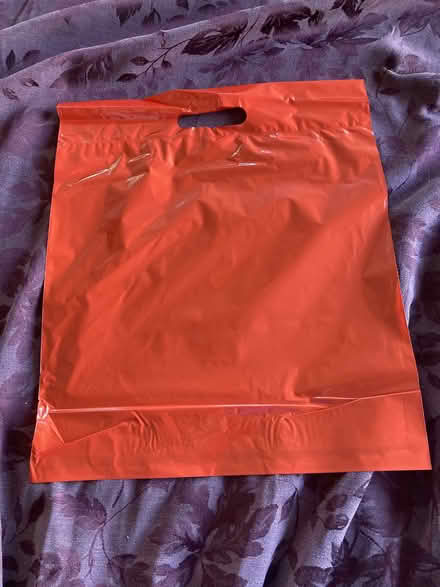 Photo of free New Red Plastic Bags (Near Eubank Costco (SE)) #1