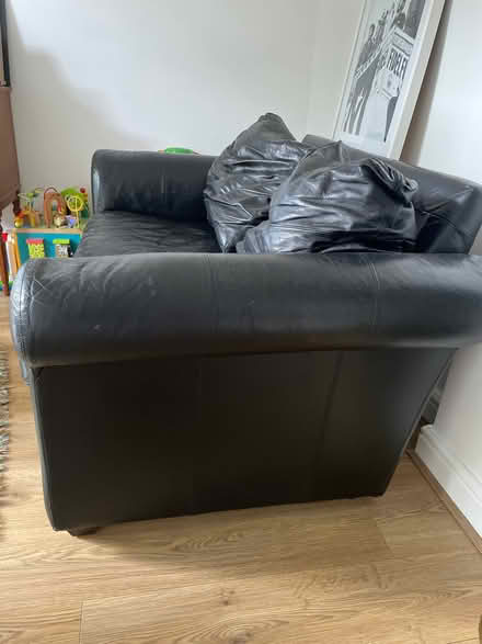 Photo of free Black leather two seated sofa (Herne Hill SE24) #4