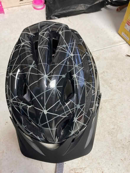 Photo of free A black and white cycling helmet size small (Greasby CH49) #1