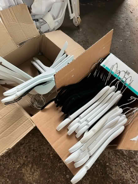 Photo of free White Wood / Black Velvety Hangers (Akron) #1