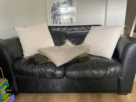 Photo of free Black leather two seated sofa (Herne Hill SE24) #1