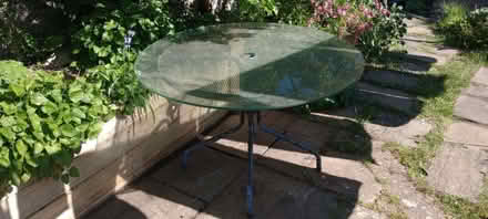 Photo of free Outdoor glass table (metal base) (Saint George's CO2) #1