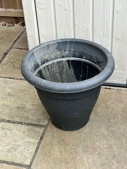 Photo of free Large black plastic pot (Poplars SG2) #1