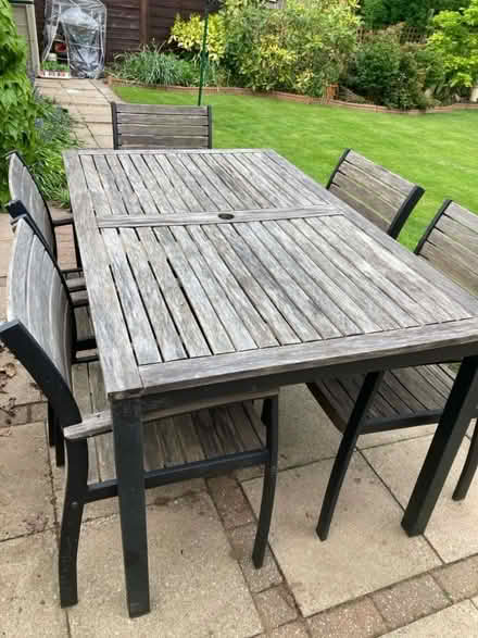 Photo of free Outdoor table (5 foot long) and 5 chairs, old! (Neath Hill MK14) #1