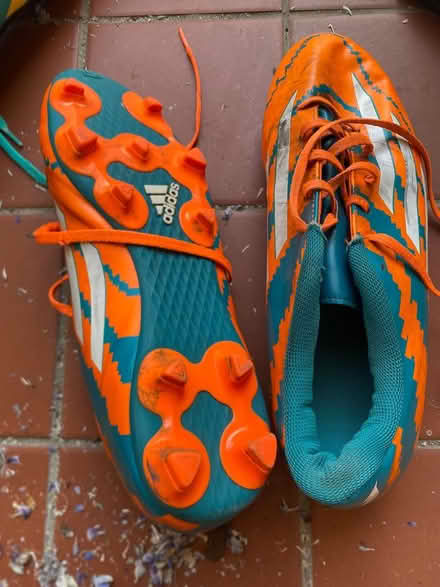 Photo of free Orange + blue rugby boots Size 10 (Heath) #2