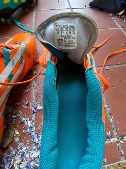 Photo of free Orange + blue rugby boots Size 10 (Heath) #3