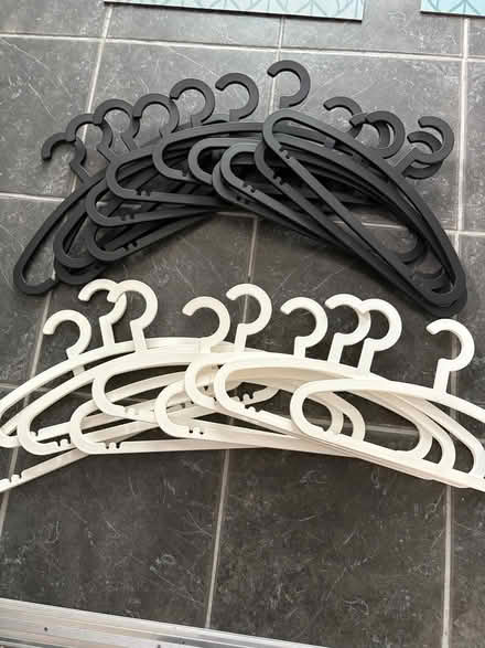 Photo of free 21 black and white clothes hangers (Birchwood LN6) #1