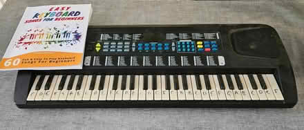 Photo of free Electric keyboard & book (Malinslee TF3) #1