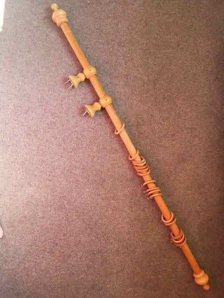 Photo of free Wooden curtain pole 116cm, plus finials and rings (Corston) #1