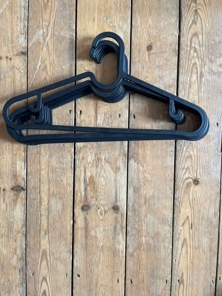 Photo of free 70 matching black plastic hangers (Osney OX2) #1