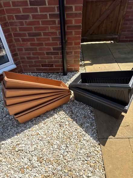Photo of free 6 shallow and 3 black planters (GL2) #1