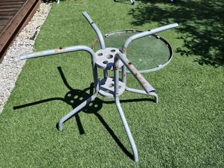 Photo of free Outdoor table, circular glass top (Bagslate Moor OL11) #1