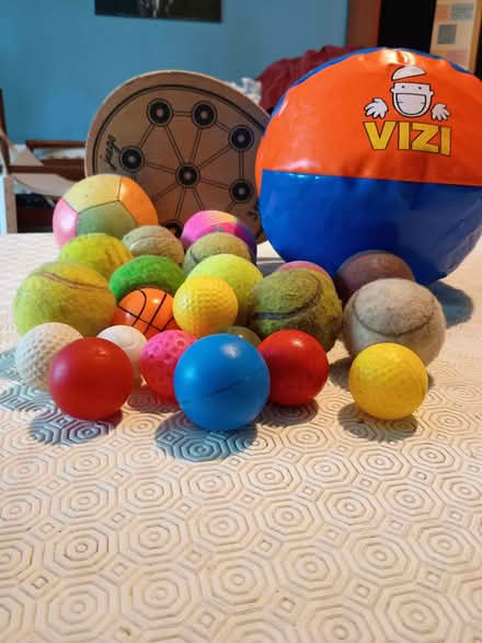 Photo of free Assorted balls and wooden bat (Chorlton M21) #1