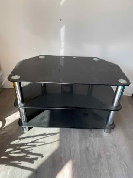 Photo of free Tv unit , black glass (Church RG2) #1