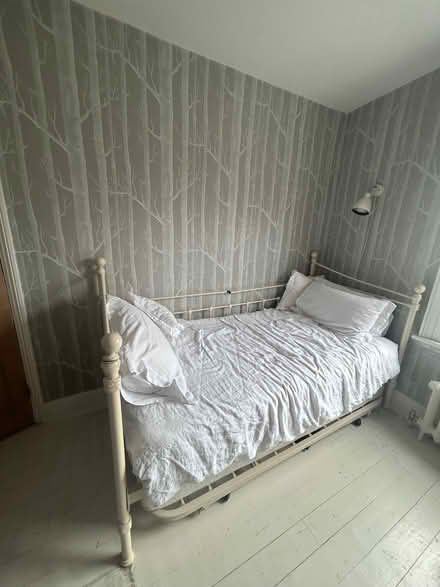 Photo of free Feather & Black iron day bed with trundle and top mattress. (Ravenscourt Park W6) #1