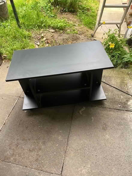 Photo of free Black TV stand (Low Edges S8) #1