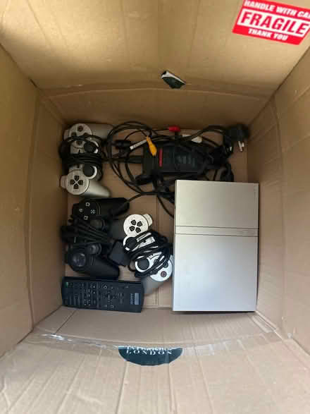 Photo of free Playstation 2 and remotes/game (Lancing, BN15) #1