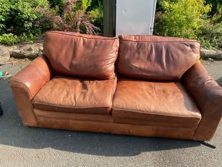Photo of free Tan leather sofa. Two seater (Westham BN24) #1
