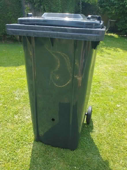 Photo of free Black Wheelie bin with two holes (Winkfield Row RG42) #1