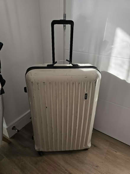 Photo of free Large suitcase (GU7 1AX) #1