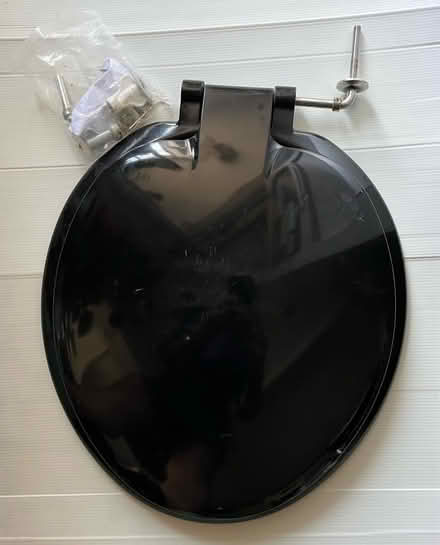Photo of free Toilet seat, black plastic (St Leonards TN38) #1