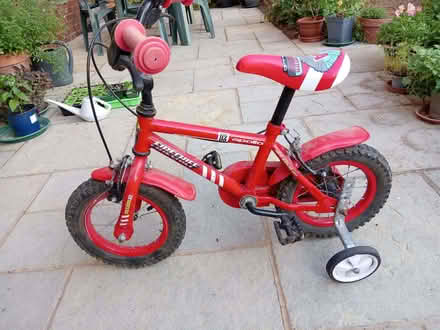 Photo of free First bike with stabilisers (Pooley Green TW20) #1