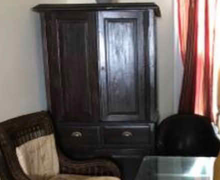 Photo of free Brown wooden tv cabinet (Washington DC) #1