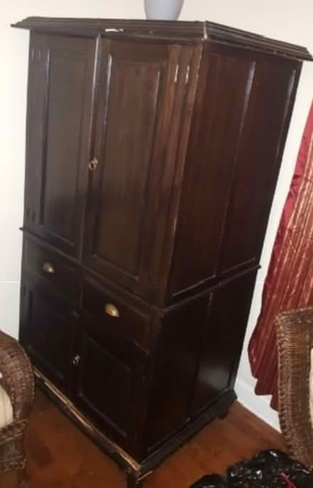 Photo of free Brown wooden tv cabinet (Washington DC) #2
