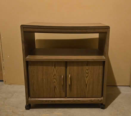 Photo of free Brown SideTable,Shelf,Doors&Casters (Kahdena Rd off Sussex) #1