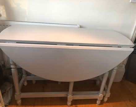 Photo of free Drop leaf wooden dining table (Mortlake Station) #1