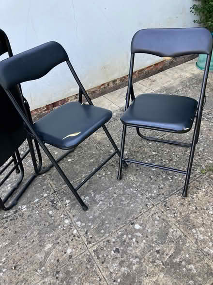 Photo of free 4 black folding chairs (Guildford, SW, GU2) #1