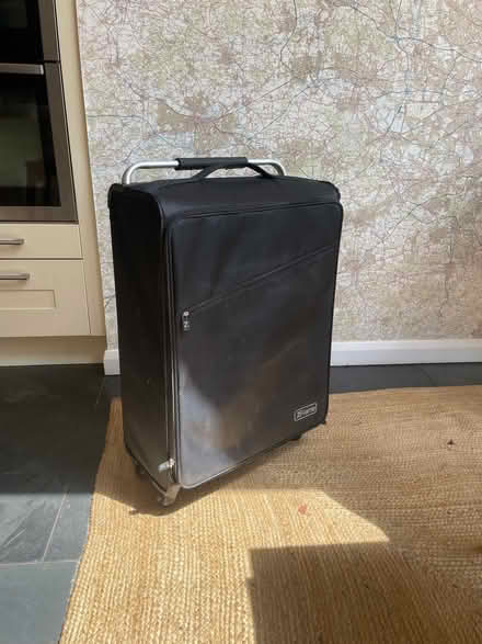 Photo of free Black lightweight suitcase with wheels (St Stephens AL3) #1