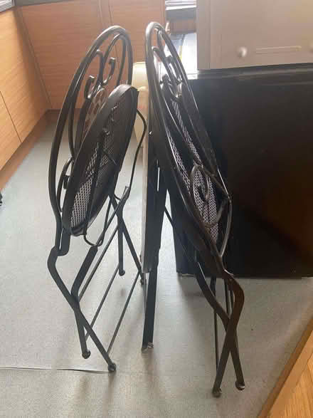 Photo of free Circular black metal mosaic table with 2 matching chairs (Penrith CA11) #2