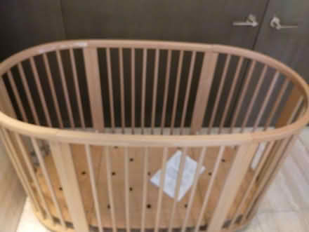 Photo of free Light brown wood oval crib, wheels (Upper West side) #3