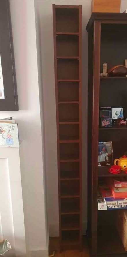 Photo of free Tall wooden CD rack (Waddon CR0) #1