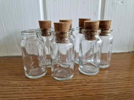 Photo of free 7 little glass bottles with corks (Woking GU22 9) #1