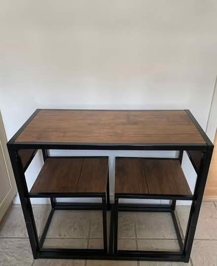 Photo of free Wood effect rectangle dining table + 2 chairs (Denton Burn) #1