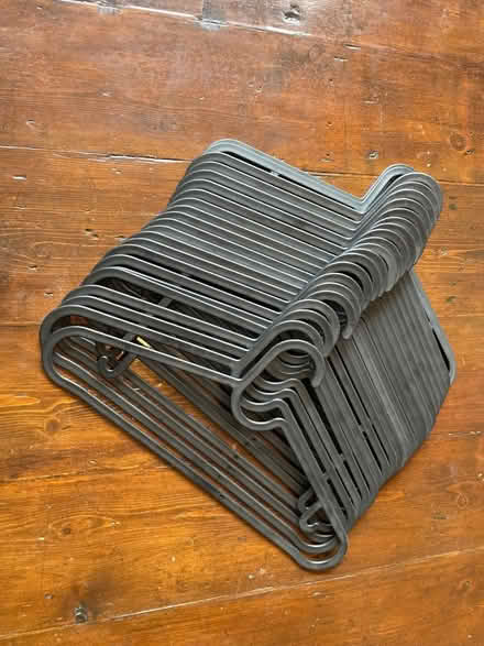 Photo of free 23 black plastic coat hangers (Leyton E11) #1