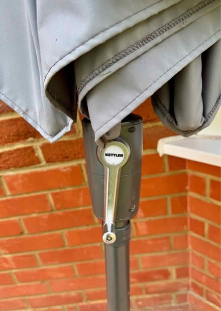 Photo of free Kettler grey wind up garden umbrella and solid base (Arborfield Garrison RG2) #1