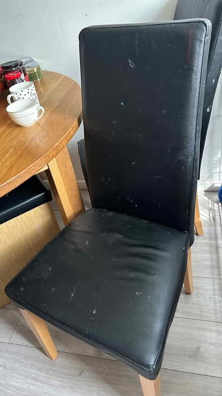 Photo of free 4 black leather chairs (Bedford area) #1