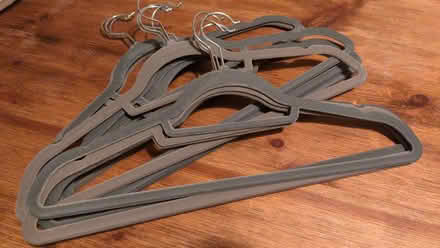 Photo of free Grey slimline hangers x 26 (Old Woking GU22) #2