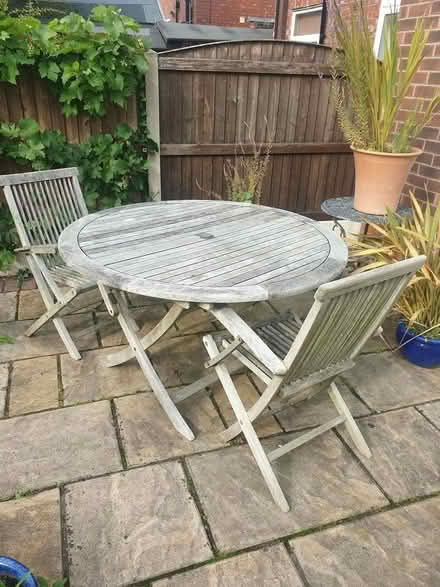Photo of free Round Teak Garden Table & 2 chairs (Marple) #1