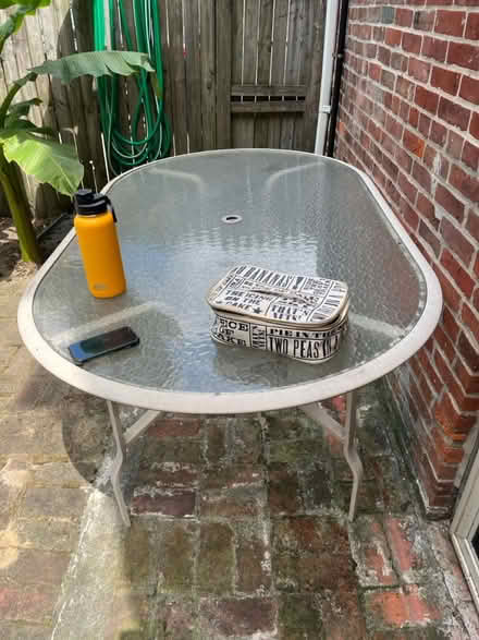 Photo of free Outside oval table and 3 chairs (Historic fells point) #1