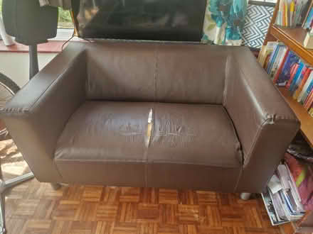 Photo of free Brown leather sofa with tear (Bexhill) #1